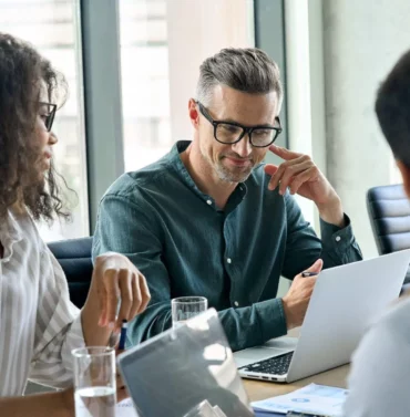 Diverse group of international business executives having a meeting in a modern office setting