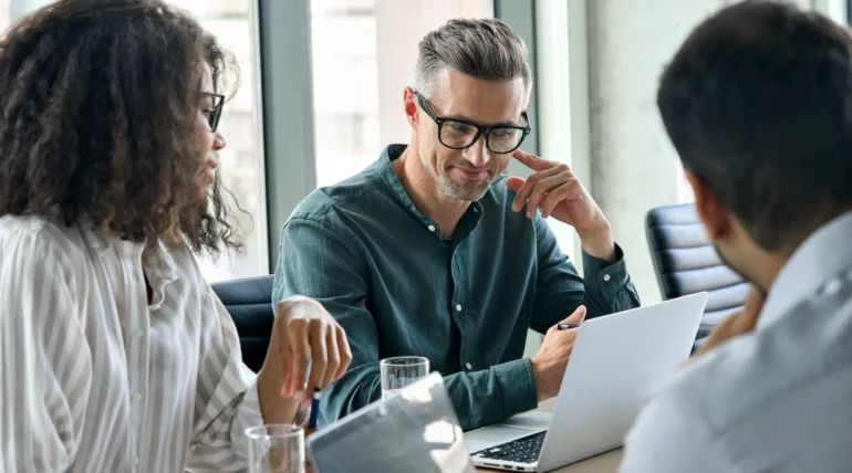 Diverse group of international business executives having a meeting in a modern office setting