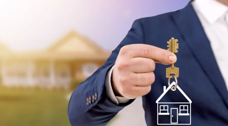 Real estate agent holding keys in front of a newly sold modern home with a welcoming exterior