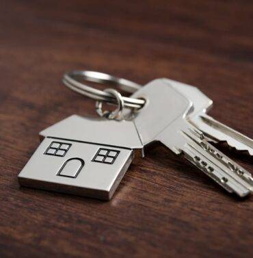 Diverse group of people gathered in a public space, engaging in conversation and community interaction